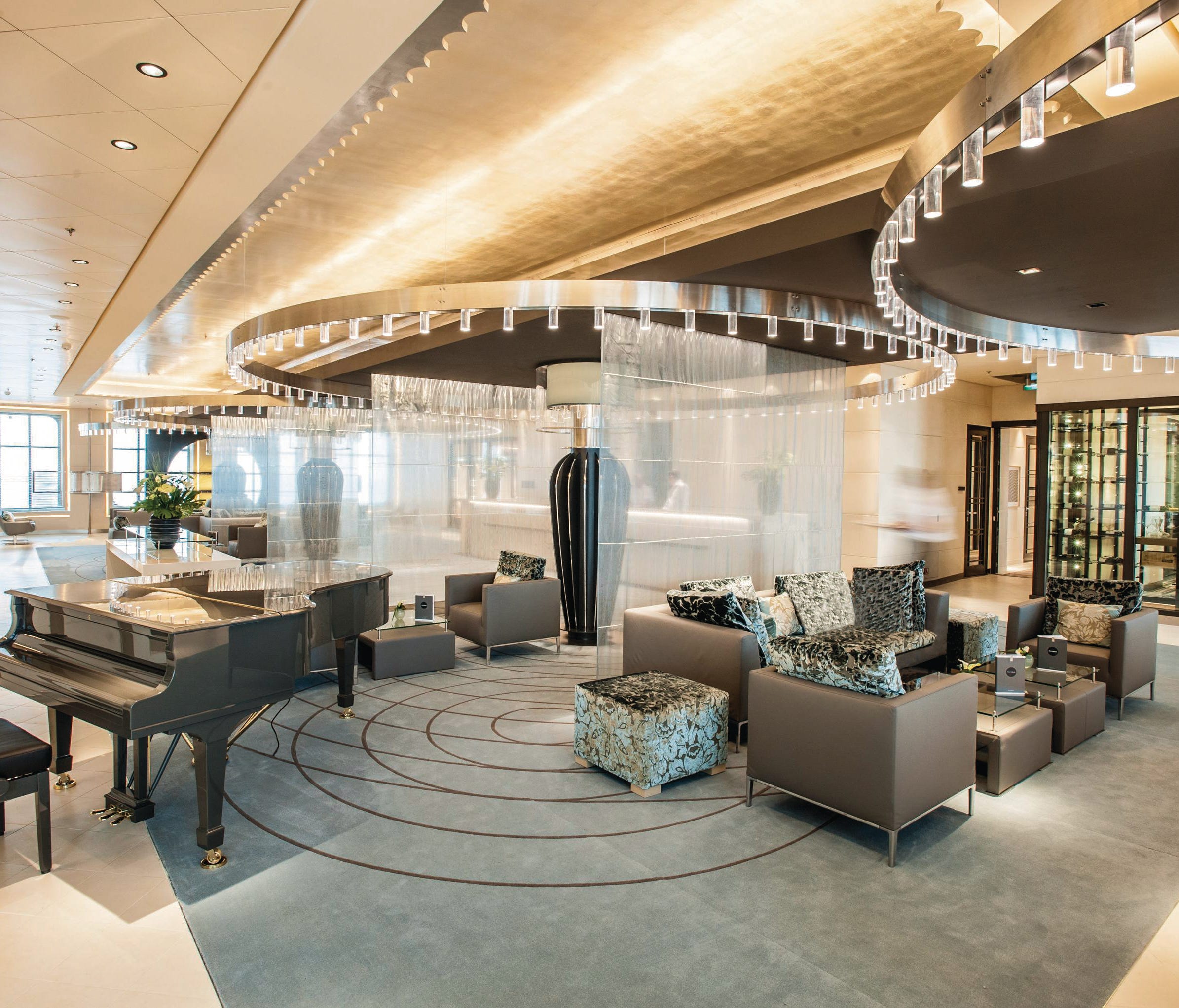 The reception area of Hapag-Lloyd Cruises' Europa 2 is spacious and elegant with high ceilings.