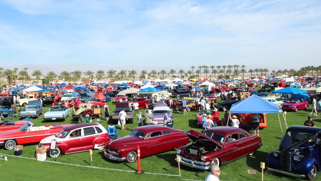 Car enthusiasts enjoyed a beautiful day while admiring vintage vehicles.