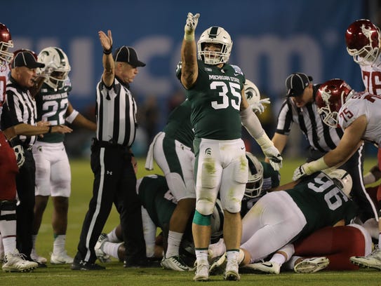Michigan State linebacker Joe Bachie celebrates a fumble