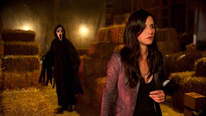 Courteney Cox appears in a scene from the horror film "Scream 4." MTV announced Tuesday that it is turning "Scream, " the movie franchise, into a television series. The goal is to put 10 episodes on the air starting next October.
