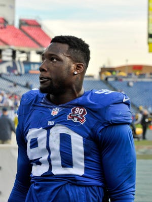 New York Giants defensive end Jason Pierre-Paul (90) leaves the field after his team defeated the Tennessee Titans 36-7 during the second half at LP Field.