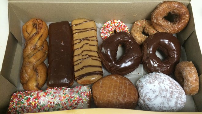 A manager's assortment from LaMar's Donuts in Phoenix comes with six regular doughnuts and six specialties.