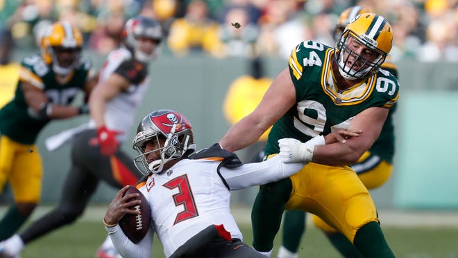 Green Bay Packers' Dean Lowry sacks Tampa Bay Buccaneers' Jameis Winston during the second half.