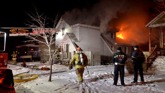 Port Huron fire fighters work a fire Friday, Nov. 21 at 733 Union Street in Port Huron.