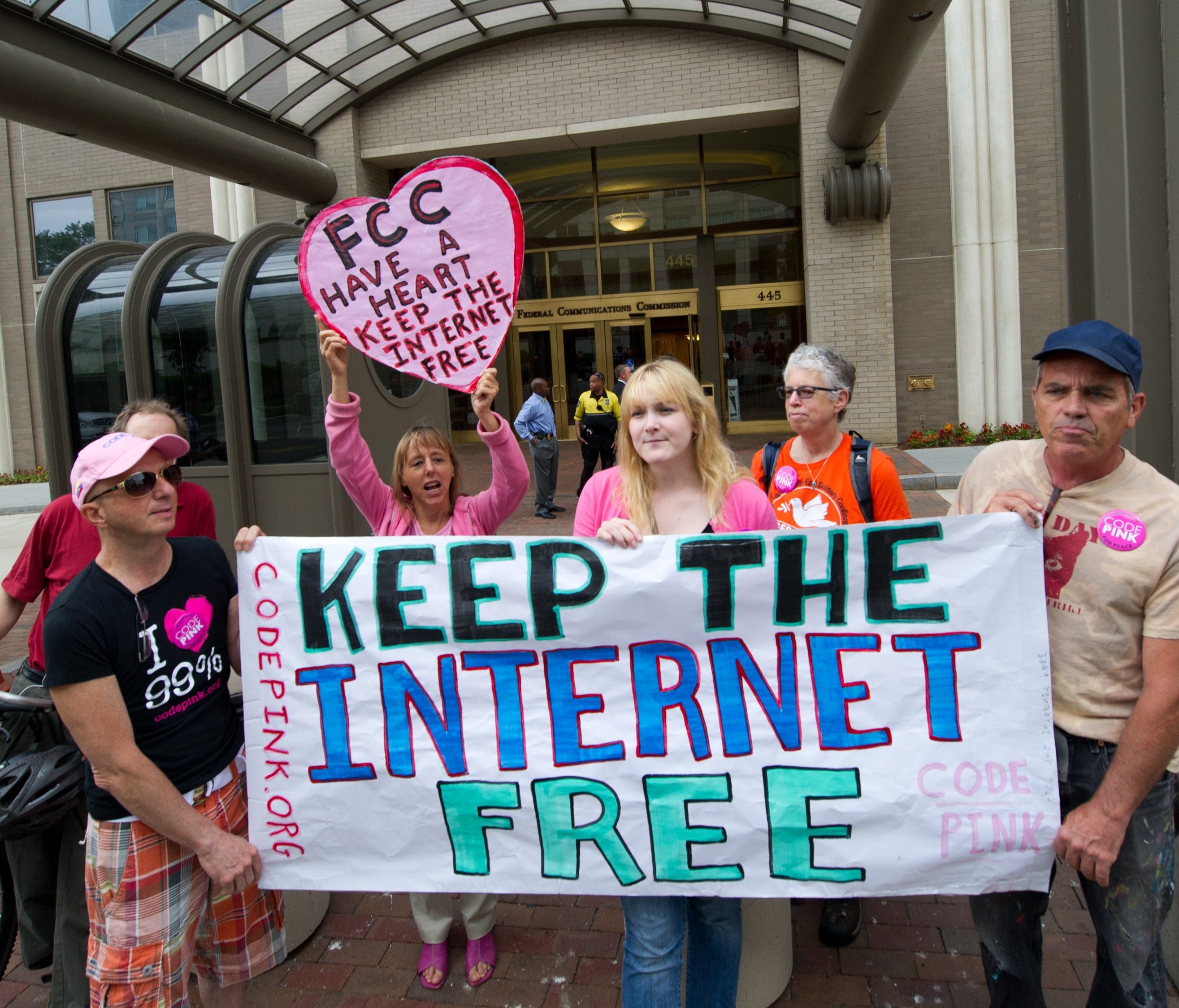 In this May 15, 2014 file photo, protesters hold a rally at the Federal Communications Commission in Washington, DC to support 