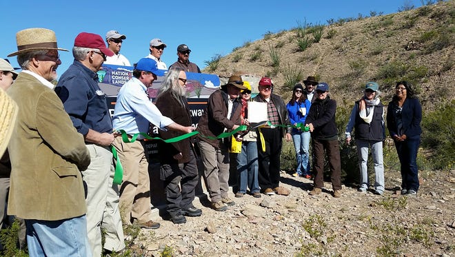 The Las Cruces Green Chamber of Commerce hosted a ribbon-cutting Saturday for a new entrance sign at the Prehistoric Trackways National Monument in Las Cruces.