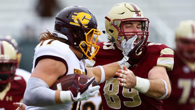 Boston College's Tommy Sweeney, right, attempts to tackle Central Michigan's Alex Briones during the second half on Saturday.