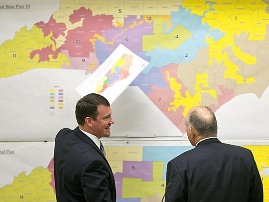 North Carolina elected officials review historical district maps in 2016.