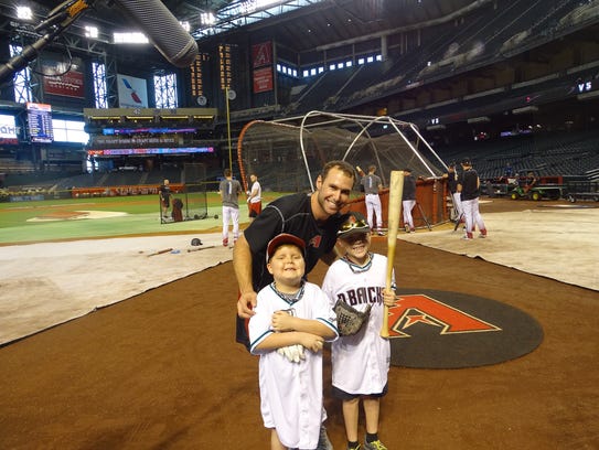 During a trip to Chase Field in 2016, Hollis (left)