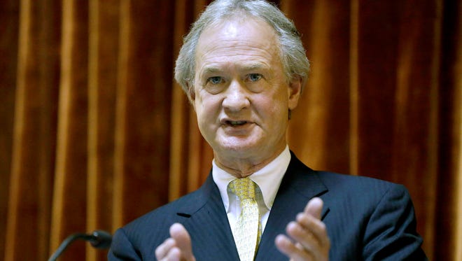In this Jan. 15, 2014, file photo, then-Rhode Island governor Lincoln Chafee delivers his State of the State address in the House chambers of the statehouse in Providence.