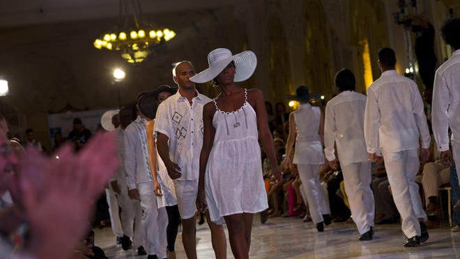 Models show off the fashions of Cuban designer Analu during Havana Fashion Week at the Alicia Alonso Grand Theater in Havana, Cuba. Cuba’s designers hope their blouses and swimsuits will become popular items with visitors.