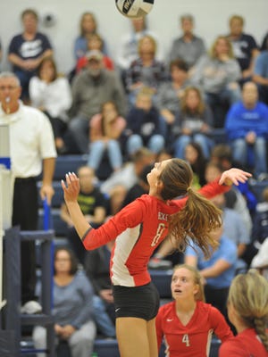 Lexi Evak smashes one at the net against Carey.