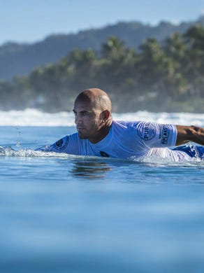 Kelly Slater paddling at the 2017 Pipe Masters in Oahu. Hawaii.