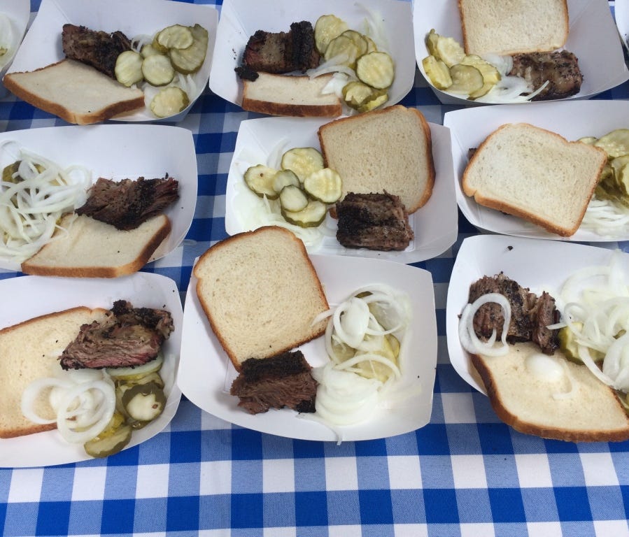 Hometown serves smoked beef short rib with pickles and onions.
