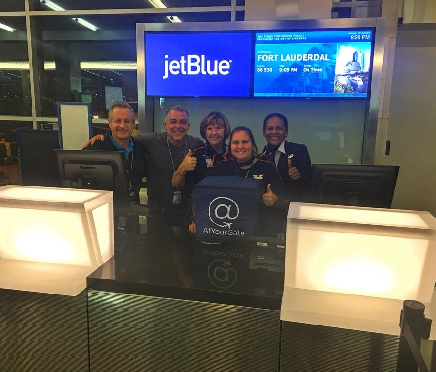 This image, provided by At Your Gate via Twitter, shows JetBlue employees after receiving an 