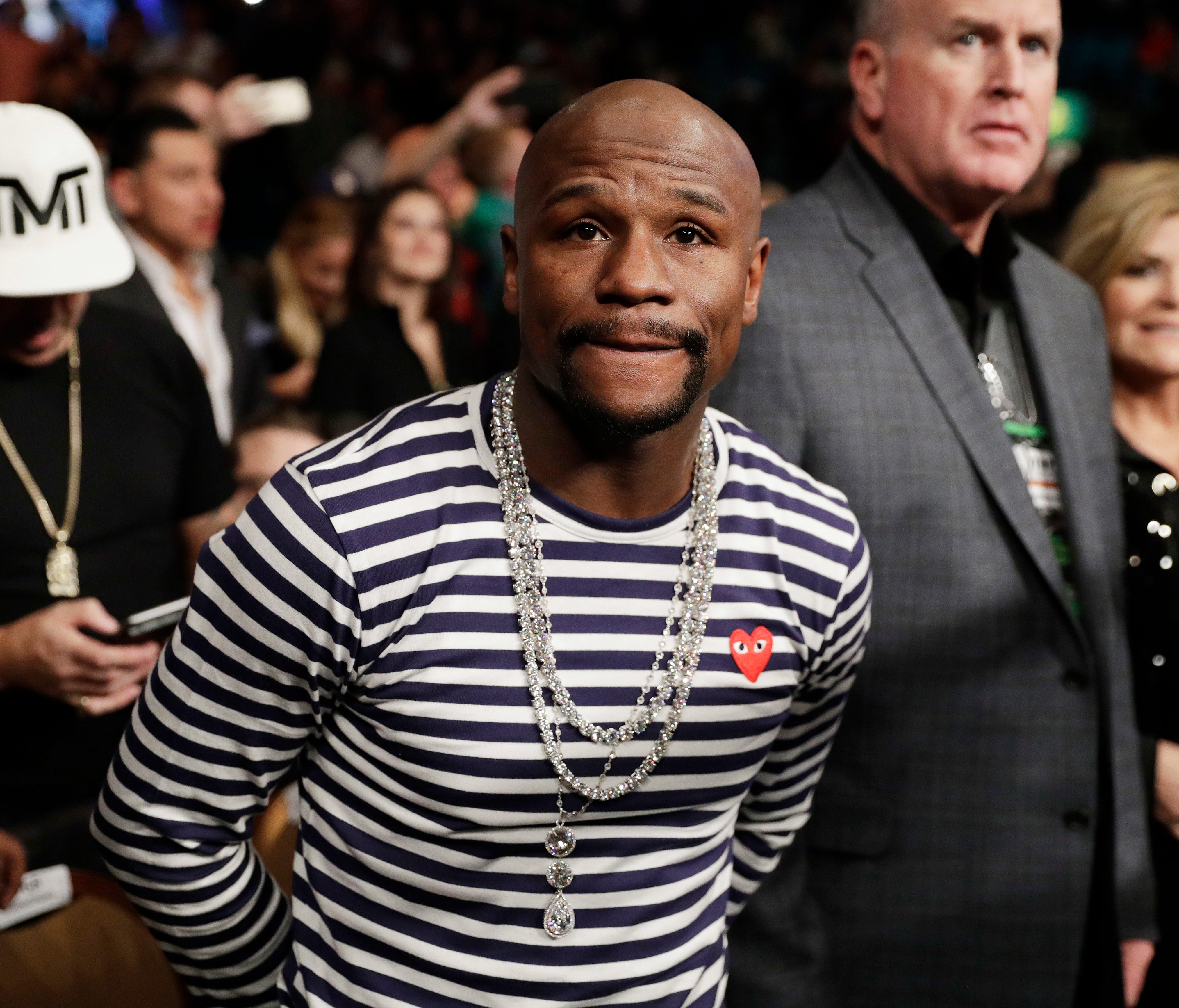 Retired boxer and boxing promoter Floyd Mayweather Jr. attends a fight between Carl Frampton, of Northern Ireland, and Leo Santa Cruz, Saturday, Jan. 28, 2017.