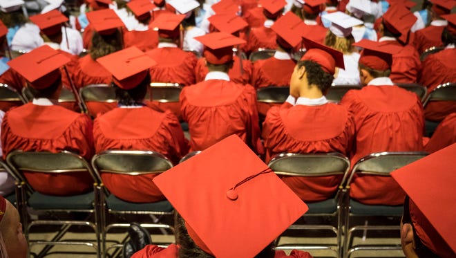 Graduating seniors wait to walk during the Port Huron High School commencement Wednesday, June 6, 2018, at McMorran Arena.