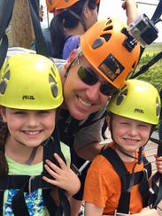 Sarah, Greg and Sam Shamus get ready to zip line in