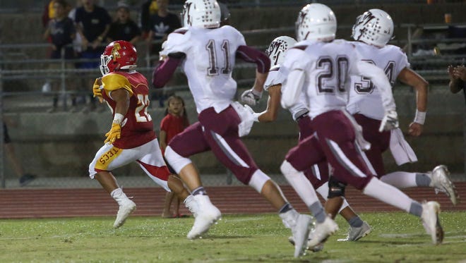 Palm Desert back Manny Sepulveda runs for a first half touchdown against Rancho Mirage, September 15, 2017.