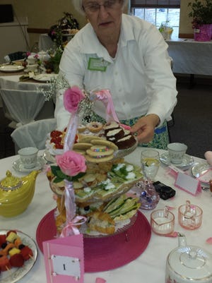 Friends of Boone County Arboretum member Audrey Ney of Union arranges a table at the group’s annual spring tea fundraiser at the Boone County Cooperative Extension in Burlington. Funds from the March 27 tea will go toward a future education and visitor center at the arboretum, at 9190 Camp Ernst Road, Union.