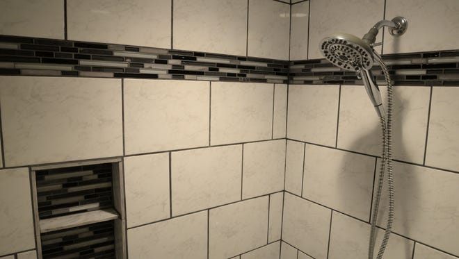 Tiled shower in upstairs 3/4 bathroom.
