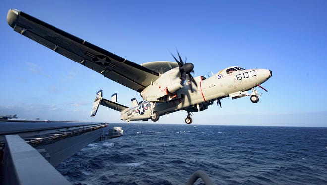 An arresting cable snapped while an E-2C Hawkeye was landing on carrier Dwight D. Eisenhower on March 18, 2016. The aircraft careened off the runway with the parted cable whipping behind. Here, an E-2C with Airborne Early Warning Squadron 123 launches of the Eisenhower carrier on Wednesday, April 13, 2016.
