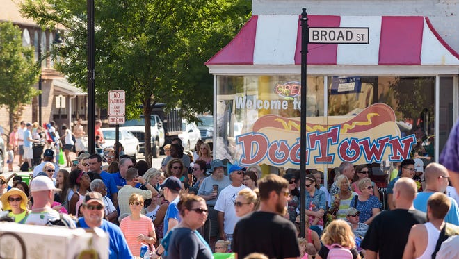 The corners of Main and Broad St. are filled to capacity as people enjoy the 2015 Middletown Peach Festival parade.