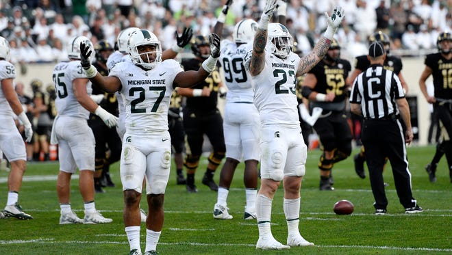 Michigan State's Khari Willis, left, and Chris Frey excite the crowd before a key Western fourth and one play late in the fourth quarter on Saturday, Sept. 9, 2017, at Spartan Stadium in East Lansing. The Spartans stopped the Broncos on the play.