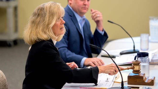 Chairwoman Janet McClelland calls the Michigan Civil Service Commission meeting to order on Wednesday, Sept. 20, 2017, at the Capitol Commons Center in Lansing. Commissioner Jase Bolger is seen in the background.