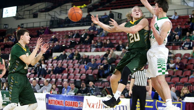 CMR's Garrison Rothwell (20) completes a no-look pass to Bryce Depping,