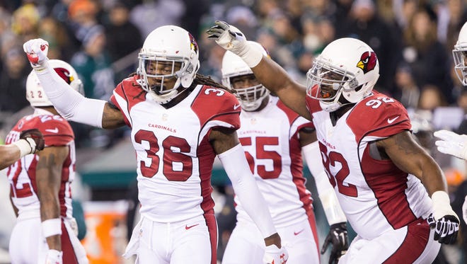 Arizona Cardinals defensive back D.J. Swearinger (36) and defensive end Frostee Rucker (92) react after a third down stop against the Philadelphia Eagles during the second quarter at Lincoln Financial Field.
