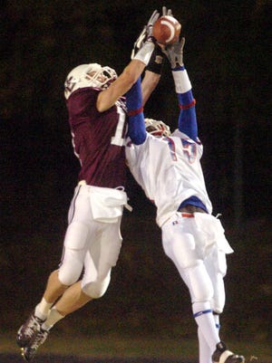 Chris LaMar breaks up a pass during a game against Christian County during the 2005 season.