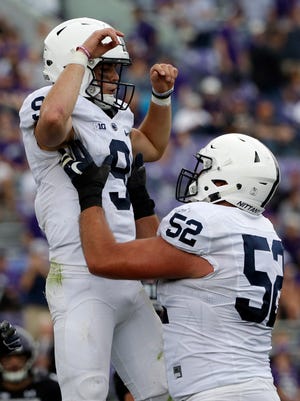 Penn State quarterback Trace McSorley, left, celebrates with offensive lineman Ryan Bates during the second half of an NCAA college football game against Northwestern in Evanston, Ill., Saturday, Oct. 7, 2017. Penn State won 31-7.