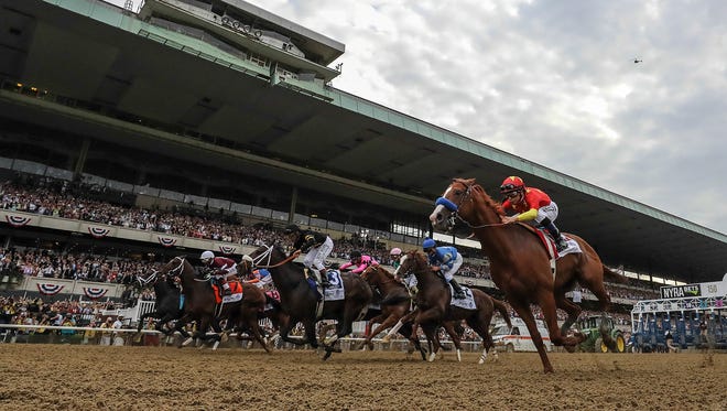 Justify with jockey Mike Smith wins the Belmont Stakes and the Triple Crown of horse racing. June 09, 2018