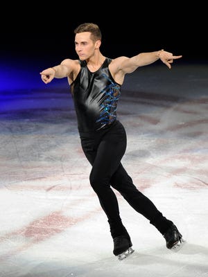 American figure skater Adam Rippon, who won a bronze medal as part of the figure skating team event at the 2018 Winter Olympics, performs for the crowd during "Stars On Ice" on Saturday at Little Caesars Arena.