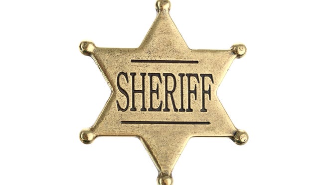 Six point sheriff star badge isolated on white