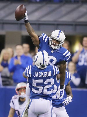 Indianapolis Colts strong safety Mike Adams celebrates an interception in the arms of teammate D'Qwell Jackson in the first half against the Patriots. Indianapolis hosted New England at Lucas Oil Stadium on Sunday, November 16, 2014. 