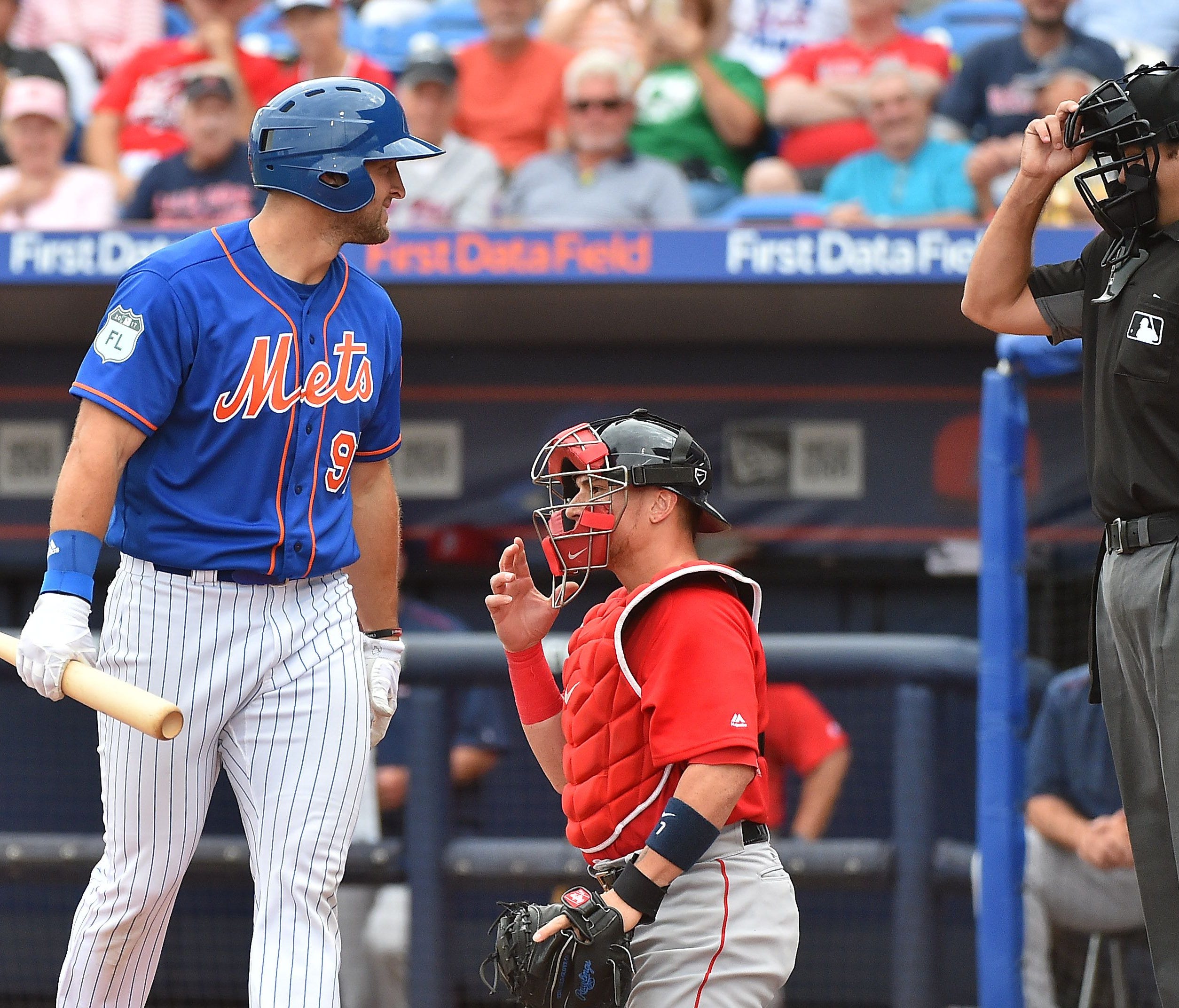 Mets designated hitter Tim Tebow has some words with the home plate umpire after striking out against the Red Sox at First Data Field in Port St. Lucie, Fla.
