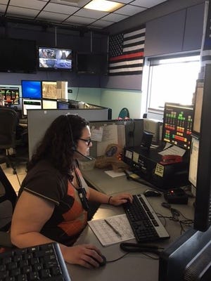 City of Mansfield 911 Communications Center dispatcher Ashley Jeffrey answers a 911 call Monday.