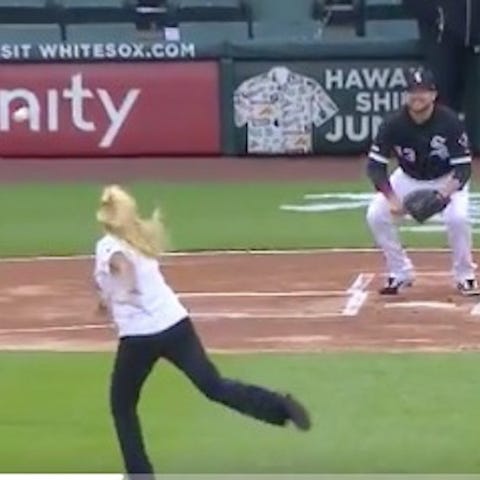 A photographer was hit on a first pitch that went...