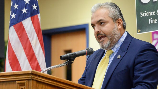 State Board of Education member Ruben Cortez speaks at a press conference, Tuesday, Sept. 6, 2016, at Paredes Elementary School in Brownsville, Texas. State Board of Education member Ruben Cortez publicly rejected a textbook under consideration by the state board, alleging it contained erroneous information, omissions, negative stereotypes and racial assertions against Mexican-American culture.