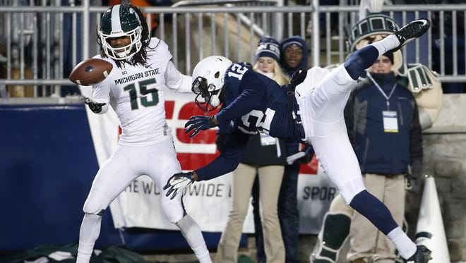 Former Michigan State cornerback Trae Waynes, right, intercepts a pass in the end zone intended for Penn State wide receiver Chris Godwin during Michigan State's win last November.
AP
Michigan State cornerback Trae Waynes (15) intercepts a pass in the end zone intended for Penn State wide receiver Chris Godwin (12) near the end of the first half of the Spartansâ€™ 34-10 victory on Saturday in Beaver Stadium. Michigan State cornerback Trae Waynes (15) intercepts a pass in the end zone intended for Penn State wide receiver Chris Godwin (12) during the second half of an NCAA college football game in State College, Pa., Saturday, Nov. 29, 2014. (AP Photo/Gene J. Puskar)