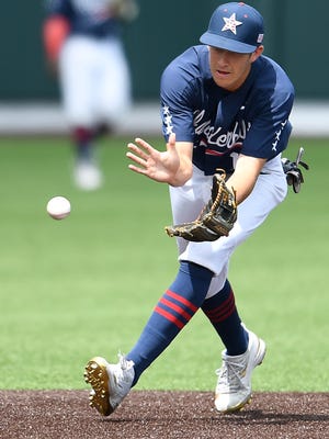 Vanderbilt shortstop Connor Kaiser (12) pulls in a ground ball to turn an out against Alabama at Hawkins Field Saturday, May 20, 2017 in Nashville, Tenn.