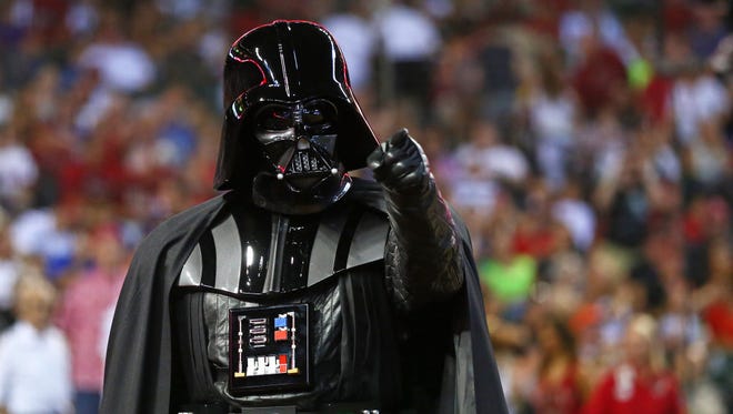 FILE : (Jun. 23, 2013) Phoenix, AZ, USA: A person dressed as Darth Vader from the movie Star Wars during the game between the Arizona Diamondbacks against the Cincinnati Reds at Chase Field.