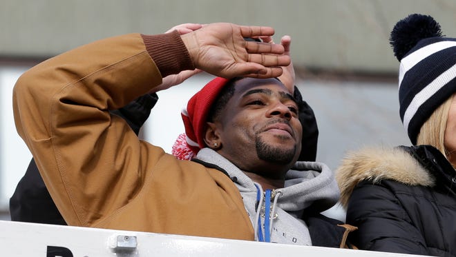 New England Patriots defensive back Malcolm Butler waves to fans during a parade in Boston Wednesday, Feb. 4, 2015, to honor the Patriots' victory over the Seattle Seahawks in Super Bowl XLIX Sunday in Glendale, Ariz. (AP Photo/Steven Senne) ORG XMIT: BX109