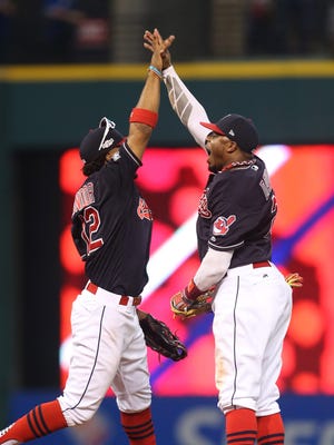 Francisco Lindor and Rajai Davis celebrate after a win.