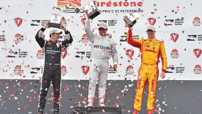 Verizon IndyCar Series driver Simon Pagenaud (L), driver Juan Pablo Montoya (C), and driver Ryan Hunter-Reay (R) celebrate after the Grand Prix of St. Petersburg at streets of St. Petersburg.
