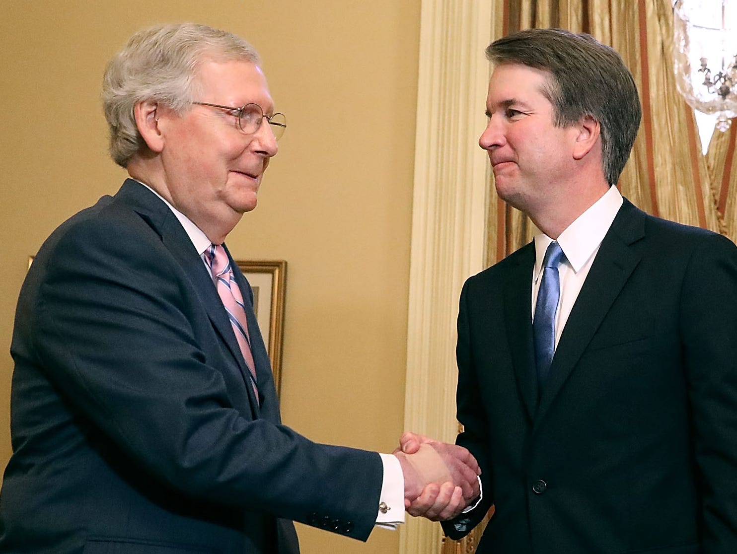 Senate Majority Leader Mitch McConnell, R-Ky., shakes