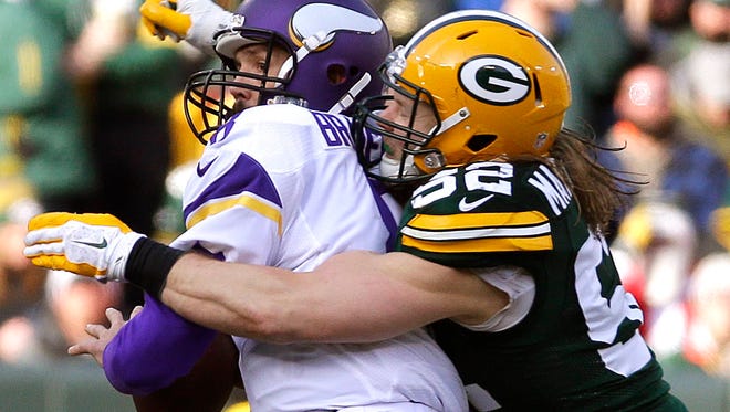 Green Bay Packers outside linebacker Clay Matthews (52) sacks Minnesota Vikings quarterback Sam Bradford (8) last December.