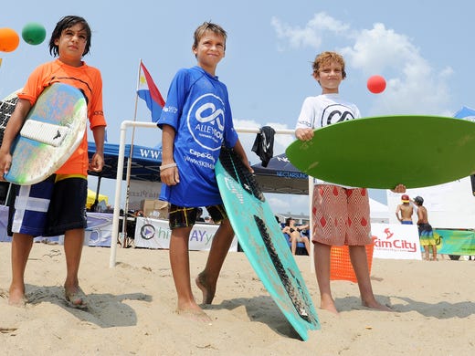 SKIMBOARDING CHAMPIONSHIPS: Mini competitors Sammy Diemidio, Burke Healy and Kaden Cox wait for their heat at Dewey Beach, the site of the Zap Amateur Skimboarding World Championships on Saturday and Sunday.